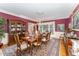 Formal dining room with a large window, china cabinet, and chandelier at 10210 Governors Drive Dr, Chapel Hill, NC 27517