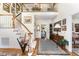 Bright foyer showcasing a staircase, wood flooring, and an open view to other rooms at 10210 Governors Drive Dr, Chapel Hill, NC 27517