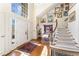 Light-filled foyer featuring hardwood floors, high ceilings, and a staircase at 10210 Governors Drive Dr, Chapel Hill, NC 27517