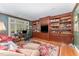 Executive home office featuring custom built-ins, hardwood floors, and a large window at 10210 Governors Drive Dr, Chapel Hill, NC 27517