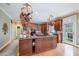 Open kitchen featuring a central island, granite counters, custom cabinetry and access to the patio at 10210 Governors Drive Dr, Chapel Hill, NC 27517