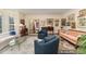Spacious living room with neutral tones, patterned rug, and comfortable seating arrangement at 10210 Governors Drive Dr, Chapel Hill, NC 27517