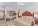 Spacious main bedroom with a king bed, neutral carpet, and an elegant sitting area at 10210 Governors Drive Dr, Chapel Hill, NC 27517