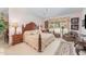 Beautiful main bedroom featuring a large bed, plush carpet, and a sitting area by the window at 10210 Governors Drive Dr, Chapel Hill, NC 27517