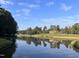 Waterfront view of home on the golf course at 10210 Governors Drive Dr, Chapel Hill, NC 27517