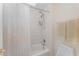 Shower with white tile and shower curtain, plus a toiletand yellow towels at 10210 Governors Drive Dr, Chapel Hill, NC 27517