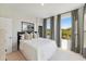 A bright bedroom featuring natural light, neutral decor, and comfortable carpet at 103 Ailey Brook Way # 200, Wake Forest, NC 27587