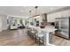 Bright, airy kitchen with stainless steel appliances, a large island, and stylish pendant lighting at 103 Ailey Brook Way # 200, Wake Forest, NC 27587