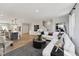 Spacious living room with modern decor, open concept layout, and natural light at 103 Ailey Brook Way # 200, Wake Forest, NC 27587