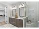 Elegant bathroom with double vanity, glass shower, and contemporary finishes at 1049 Coldspring Circle, Durham, NC 27705