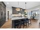 Modern kitchen with stainless steel appliances, a center island with seating, and open layout at 1049 Coldspring Circle, Durham, NC 27705