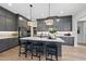 Stylish kitchen featuring stainless steel appliances, a large island, and warm wood floors at 1049 Coldspring Circle, Durham, NC 27705