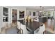 Dining area with a dark wood table, seating for six, and modern lighting, open to the kitchen at 105 Ailey Brook Way # 200, Wake Forest, NC 27587
