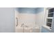 Bright bathroom features a walk-in tub, providing accessibility and relaxation at 107 Oak Park Dr, Benson, NC 27504