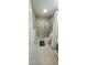 Compact bathroom featuring a toilet, shower with curtain, tile floor, and linen closet at 107 Oak Park Dr, Benson, NC 27504
