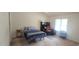Comfortable bedroom featuring a bed, study desk and chair, and natural light from the window at 107 Oak Park Dr, Benson, NC 27504