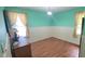 Bedroom with neutral walls, wooden floors, and natural light from a window at 107 Oak Park Dr, Benson, NC 27504