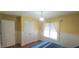 A cheerful bedroom with neutral carpet, natural light, and a closet for storage at 107 Oak Park Dr, Benson, NC 27504