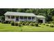 Charming single-story home with a manicured lawn and landscaping at 107 Oak Park Dr, Benson, NC 27504