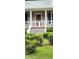 Inviting front porch with white railing and gated stairs leading to a cozy entrance at 107 Oak Park Dr, Benson, NC 27504