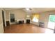 Spacious living room featuring a fireplace, wood flooring, and plenty of natural light at 107 Oak Park Dr, Benson, NC 27504