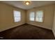 Bedroom with carpeted floors, and two windows that provide natural light at 1202 Kilby St, Burlington, NC 27215