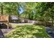 Lush backyard with lots of trees, an outdoor shed, and a place to park cars at 1304 N Duke St, Durham, NC 27701
