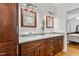 Bathroom featuring double vanities, cherry cabinets, and marble countertops at 1304 N Duke St, Durham, NC 27701
