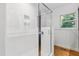 Bright bathroom featuring a large glass shower with white subway tile and a window for natural light at 1304 N Duke St, Durham, NC 27701