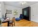 Functional bedroom with hardwood floors and unique furniture at 1304 N Duke St, Durham, NC 27701