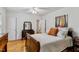 Cozy bedroom with hardwood floors, dresser, and neutral tones at 1304 N Duke St, Durham, NC 27701