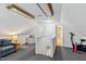 Spacious bonus room with gray carpet and access to a bathroom that has a ceiling with exposed beams at 1304 N Duke St, Durham, NC 27701