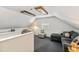 Well lit bonus room with gray carpet, natural light, and comfortable seating with great flow at 1304 N Duke St, Durham, NC 27701