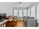 Bright living room with hardwood floors, traditional furniture, and lots of natural light at 1304 N Duke St, Durham, NC 27701