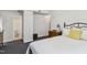 Comfortable main bedroom with grey carpet and a connecting bathroom with white tiled floors at 1304 N Duke St, Durham, NC 27701
