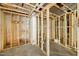An unfinished basement with exposed framing, masonry and existing plumbing elements at 1407 Arnette Ave, Durham, NC 27707