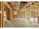 Unfinished basement with a door and window, ready for your design ideas at 1407 Arnette Ave, Durham, NC 27707