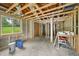 Unfinished basement with exposed wood beams and concrete walls, ready for remodeling and customization at 1407 Arnette Ave, Durham, NC 27707