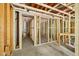 Unfinished basement featuring exposed framing and a concrete floor, offering potential for customization at 1407 Arnette Ave, Durham, NC 27707