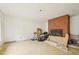 Spacious living room featuring a brick fireplace with exposed brick; ready for remodel or renovation at 1407 Arnette Ave, Durham, NC 27707