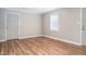 A living room featuring luxury vinyl plank flooring and neutral-toned paint at 1416 Betz St, Rocky Mount, NC 27803