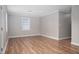 An empty living room featuring luxury vinyl plank flooring and neutral-toned paint at 1416 Betz St, Rocky Mount, NC 27803