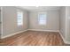 An empty living room featuring luxury vinyl plank flooring and neutral-toned paint at 1416 Betz St, Rocky Mount, NC 27803