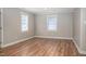An empty living room featuring luxury vinyl plank flooring and neutral-toned paint at 1416 Betz St, Rocky Mount, NC 27803
