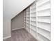 Cozy attic space with neutral carpeting and built-in shelves at 1601 Balkan Rd, Fuquay Varina, NC 27526