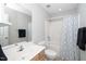 Clean full bathroom featuring a shower/tub combo and modern fixtures at 1601 Balkan Rd, Fuquay Varina, NC 27526