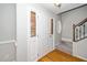Entryway features a wood floor, sidelight windows, and staircase to the upper level at 1601 Balkan Rd, Fuquay Varina, NC 27526