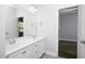 Bathroom with a double vanity, a large mirror, and neutral gray walls create a bright space at 170 Kinsale Ct, Garner, NC 27529