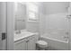 The neutral-toned bathroom includes a single sink vanity and combined tub and shower at 170 Kinsale Ct, Garner, NC 27529