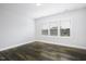 This bedroom offers natural light and neutral paint, showcasing the modern flooring at 170 Kinsale Ct, Garner, NC 27529